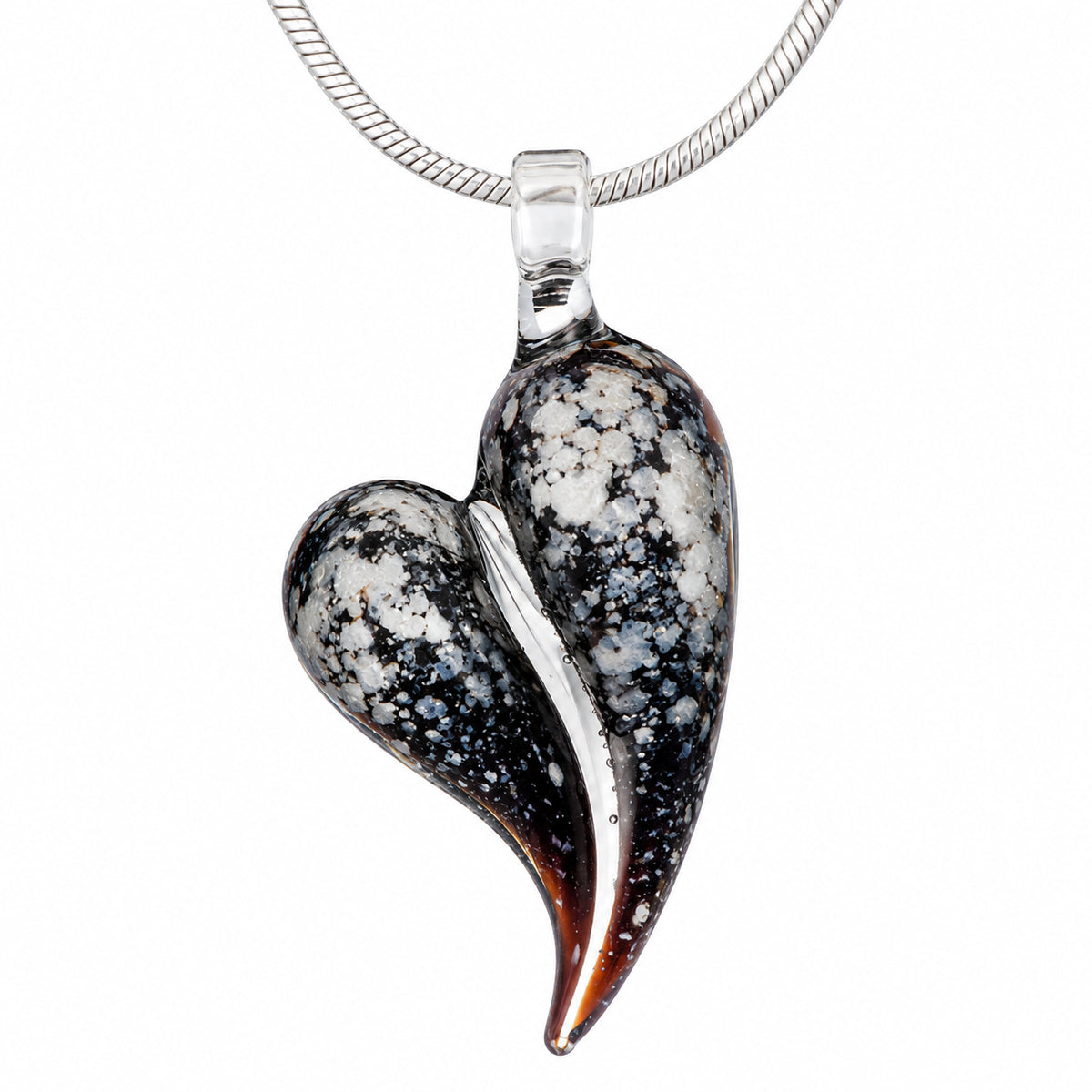 A speckled black Obsidian glass heart cremation pendant infused with a loved one's ashes