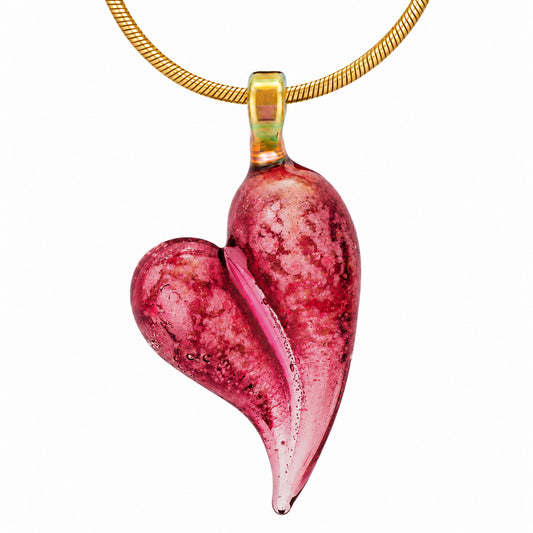 A Tourmaline glass heart cremation pendant infused with a loved one's ashes