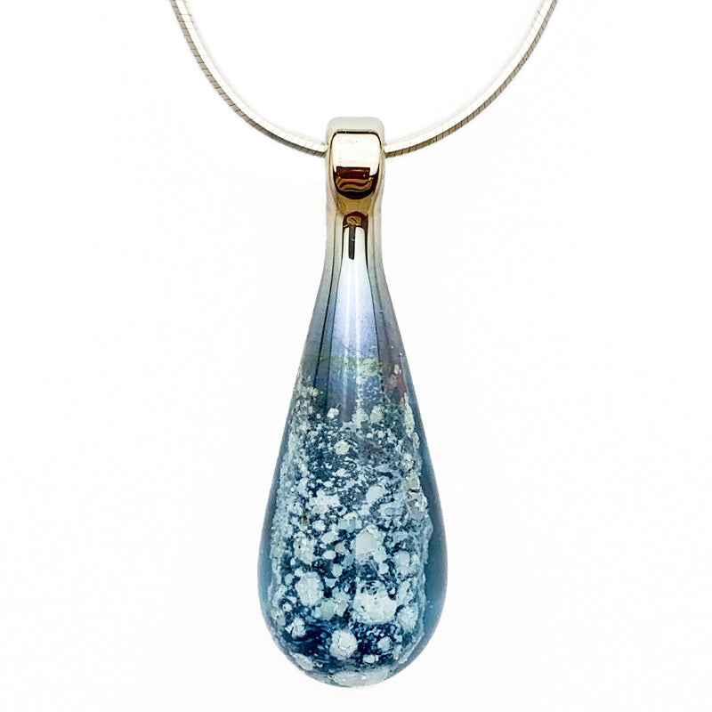 A cool-blue glass teardrop pendant necklace infused with cremation ashes, showcased on a sturdy silver snake chain against a clean white background.