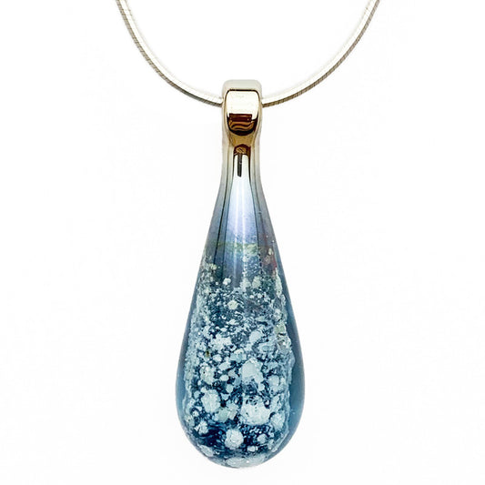 A cool-blue glass teardrop pendant necklace infused with cremation ashes, showcased on a sturdy silver snake chain against a clean white background.